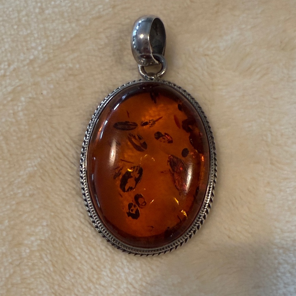Elegant Amber Pendant with Silver Accents